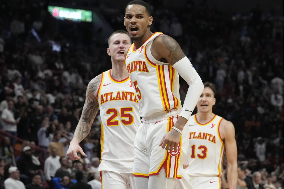 Atlanta Hawks guard Dejounte Murray (5) reacts after scoring the game winning basket during the second half of an NBA basketball game against the Miami Heat, Friday, Jan. 19, 2024, in Miami. (AP Photo/Marta Lavandier)