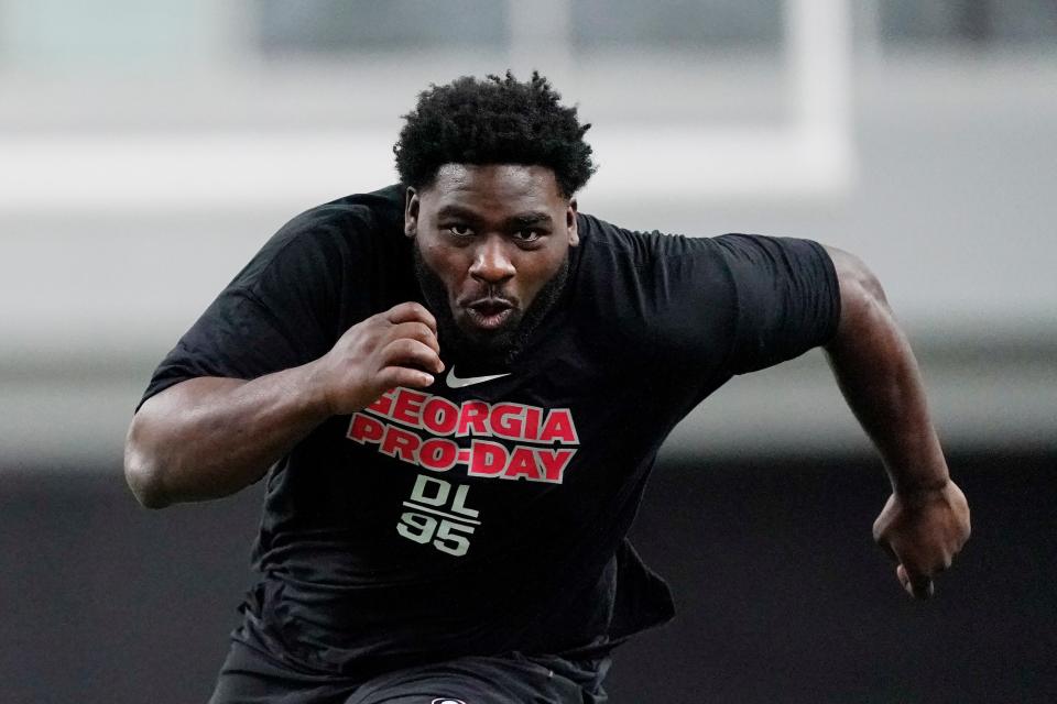 Devonte Wyatt runs football drills during Georgia's Pro Day on Wednesday, March 16, 2022, in Athens, Ga. (AP Photo/Brynn Anderson)