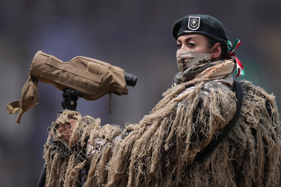 VARIOUS CITIES, MEXICO - SEPTEMBER 16: A soldier looks on during the Independence Day military parade at Zocalo Square on September 16, 2020 in Various Cities, Mexico. This year El Zocalo remains closed for general public due to coronavirus restrictions. Every September 16 Mexico celebrates the beginning of the revolution uprising of 1810. (Photo by Hector Vivas/Getty Images)