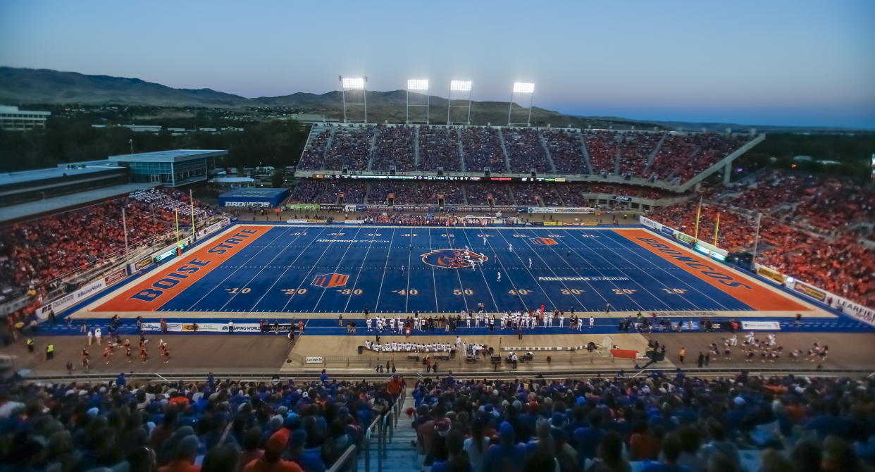 Boise State’s Albertsons Stadium is known for its famous blue turf. (AP Photo/Otto Kitsinger)