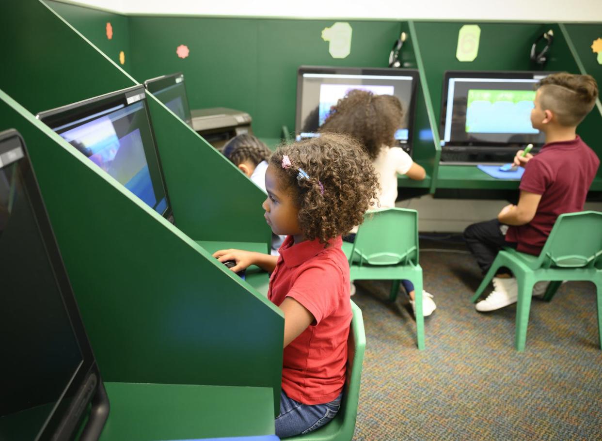 <span class="caption">Online activities can squeeze out time for other important parts of growing up.</span> <span class="attribution"><a class="link " href="https://www.gettyimages.com/detail/photo/independent-hispanic-schoolgirl-using-a-desktop-royalty-free-image/1166252121" rel="nofollow noopener" target="_blank" data-ylk="slk:JohnnyGreig/E+ via Getty Images;elm:context_link;itc:0;sec:content-canvas">JohnnyGreig/E+ via Getty Images</a></span>