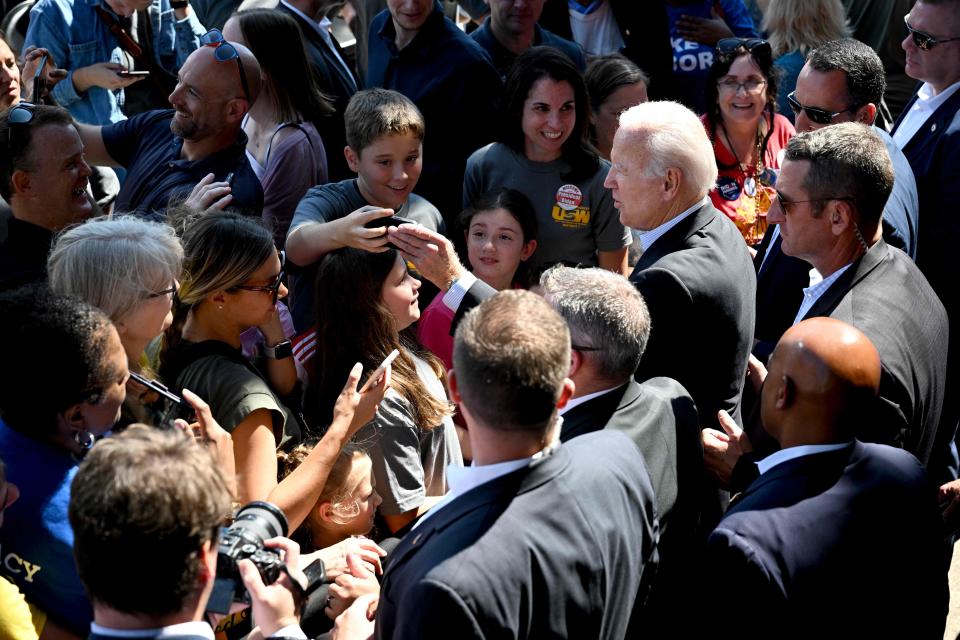 President Joe Biden takes photos with attendees during the Milwaukee Area Labor Council's annual Laborfest at Henry Maier Festival Park in Milwaukee, Wisconsin, on September 5, 2022. - Biden is celebrating Labor Day by delivering remarks on the dignity of American workers in Pittsburgh, Pennsylvania, and Milwaukee, Wisconsin.