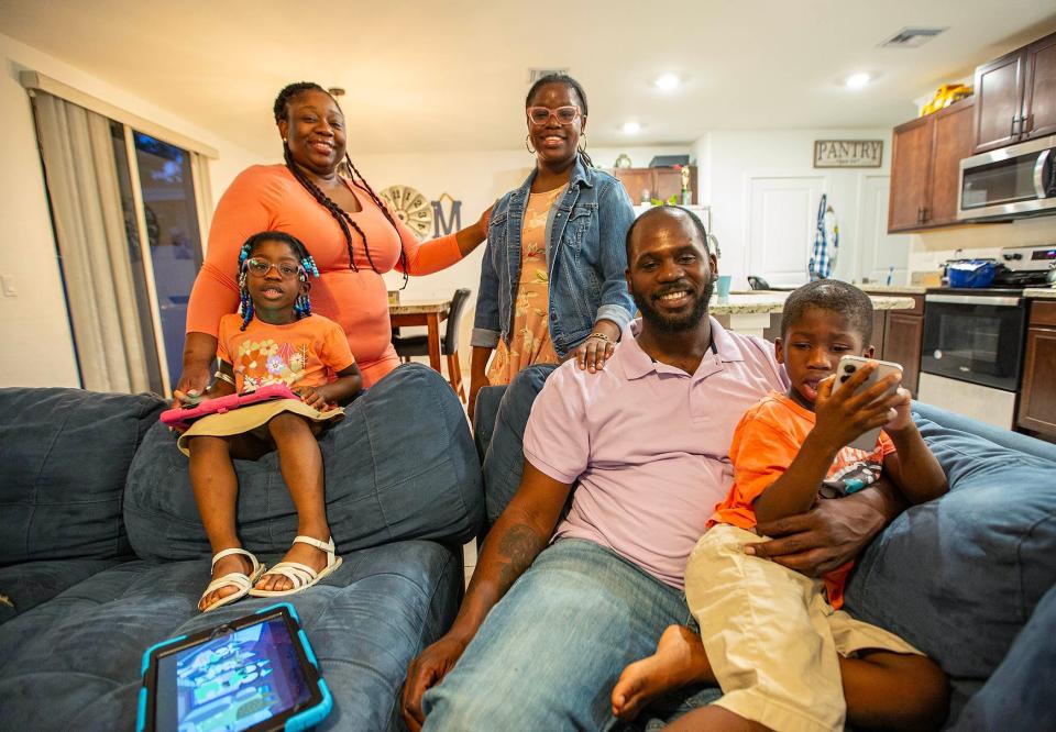 Season to Share Metcalf family at home in Greenacres. From left Khadean Metcalf, 39, mom, with daughters Serene, 4, Empress 17, husband Jeffrey, 36, and son Jeffrey Jr, 4. Serene and her twin brother Jeffrey Jr were diagnosed with autism.