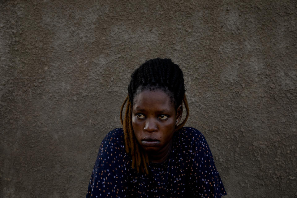 Paska Itwari Beda, the young mother of five children, sits at her Juba, South Sudan home, Saturday, May 29, 2021. Even before the pandemic hit, South Sudanese women were accustomed to building lives on the edge of uncertainty. But COVID-19 is shaking that fragile foundation. The country is just a decade old and one of the world's most difficult places to raise children. (AP Photo/Adrienne Surprenant)