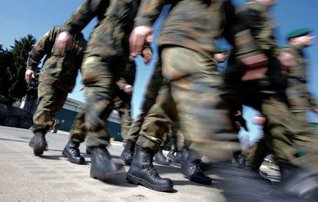 FILE PHOTO: German Bundeswehr armed forces soldiers of the 371st armoured infantry battalion march during a media day of the NATO drill 'NOBLE JUMP 2015' at the barracks in Marienberg April 10, 2015. The 371st armoured infantry battalion is part of the NATO Response Force (NRF) and Very High Readiness Joint Task Force (VJTF). REUTERS/Fabrizio Bensch/File Photo