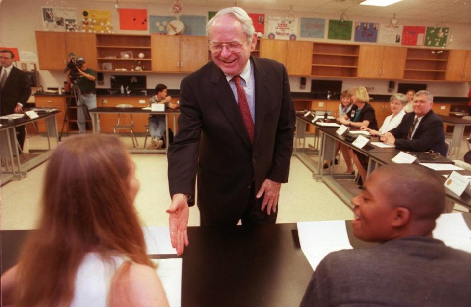 Sen. Lauch Faircloth shakes hands with students May 4, 1998, during a visit to Cary High School. The former U.S. senator died Sept. 14, 2023, at the age of 95.