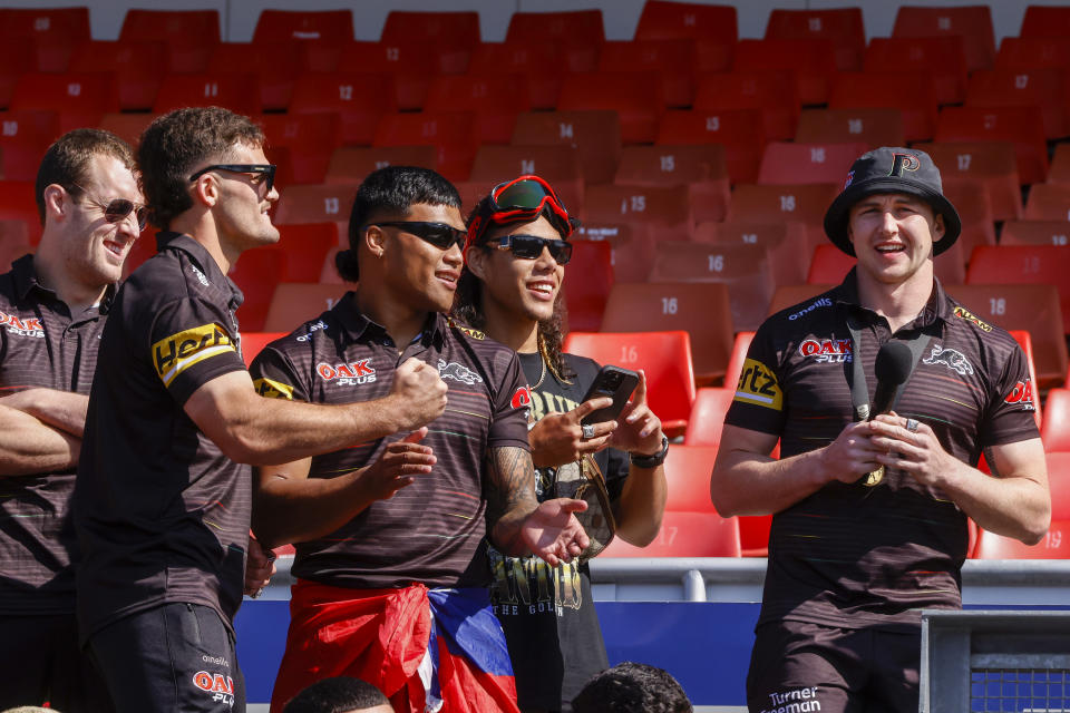 Penrith Panthers players, pictured here celebrating with fans at BlueBet Stadium.