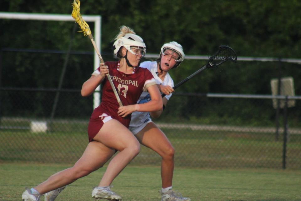 Episcopal attacker Maeve O'Neil (13) advances while trying to hold off Ponte Vedra's Avery Hopf (8) during the FHSAA Region 1-1A high school girls lacrosse final on May 3, 2024. [Clayton Freeman/Florida Times-Union]