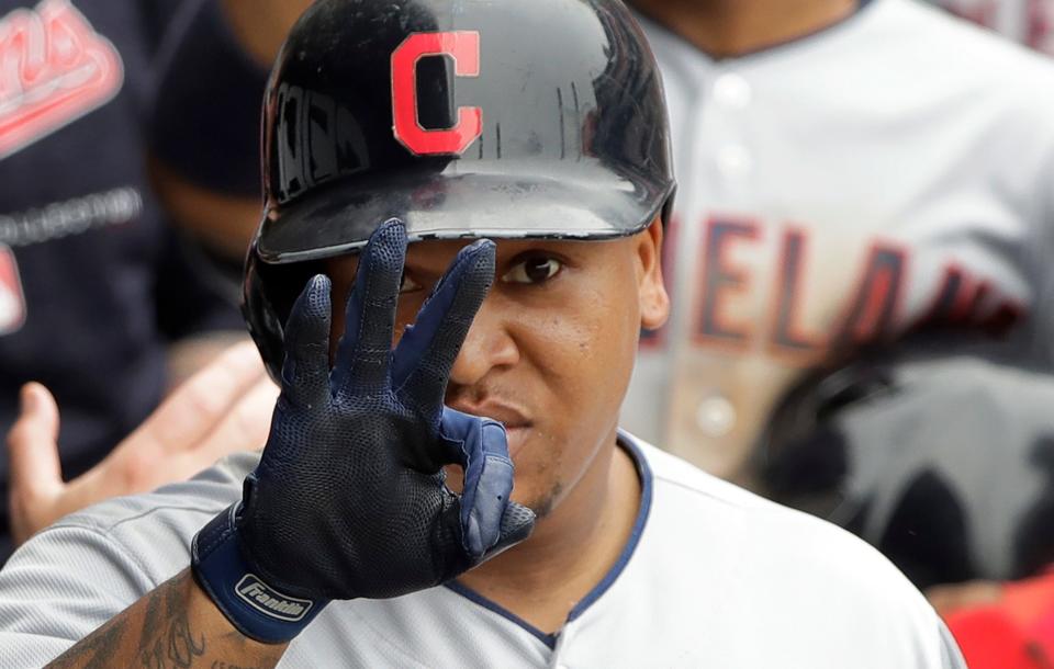 Cleveland Indians' Jose Ramirez signals his mother while celebrating in the dugout after hitting a two-run home run off Chicago White Sox's Chris Volstad on June 14, 2018, in Chicago.