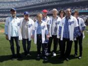 The Beach Boys pose on the field after performing the national anthem before the Los Angeles Dodgers home opener against the Pittsburgh Pirates in Los Angeles, April 10, 2012.