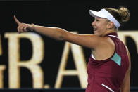 Amanda Anisimova of the U.S. celebrates after defeating Naomi Osaka of Japan in their third round match at the Australian Open tennis championships in Melbourne, Australia, Friday, Jan. 21, 2022. (AP Photo/Simon Baker)