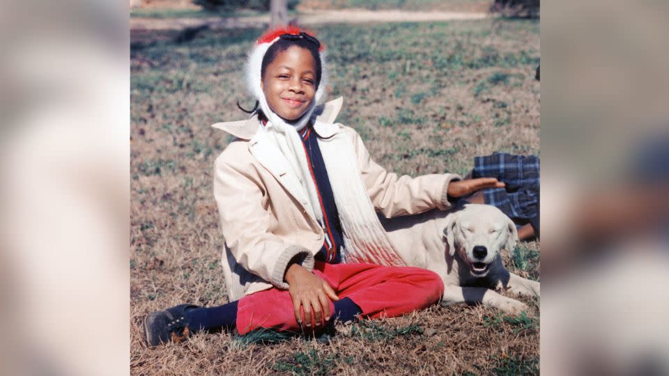 Denise McNair, one of the victims of the 16th Street Baptist Church bombing poses in the front yard with her dog Whitey in 1962 in Birmingham, Alabama.  (Photo by Chris McNair/Getty Images) - Chris McNair/Getty Images