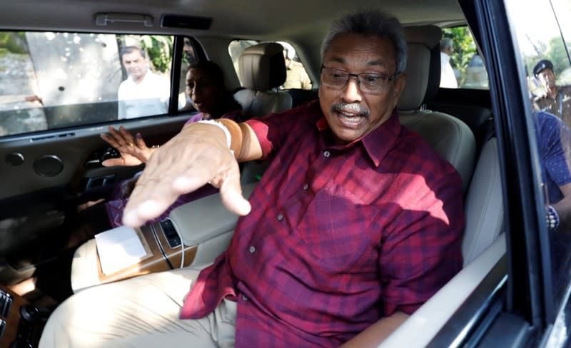 Sri Lanka People's Front party presidential election candidate and former wartime defence chief Rajapaksa reacts as he leaves after casting his vote during the presidential election in Colombo