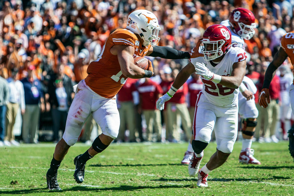 DALLAS, TX - OCTOBER 12: Texas Longhorns defensive back Brandon Jones (19) returns a pass intercepted in the end zone during a game between the Texas Longhorns and the Oklahoma Sooners on October 12, 2019, at the Cotton Bowl in Dallas, Texas. (Photo by John Korduner/Icon Sportswire via Getty Images)