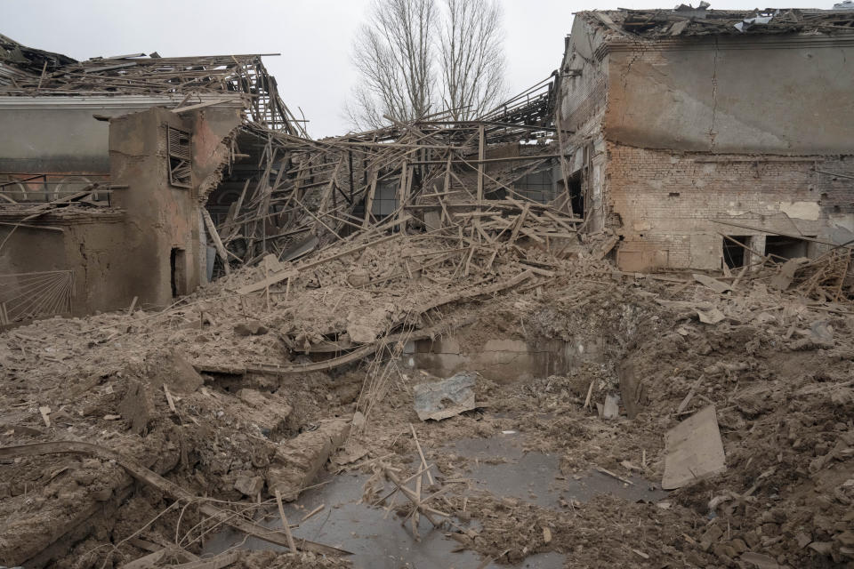 The remains of an industrial building surrounded by apartment houses after a night Russian rocket attack in Sloviansk, Ukraine, Saturday, Jan. 27, 2024. (AP Photo/Efrem Lukatsky)