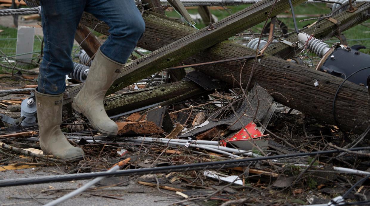 Cleanup continues on Jackson St., Friday, March 15, 2024 in Selma, Ini. The tornado that hit this street came as fast as it went, 10 seconds at its most intense point, say most people in Selma. Neighbors and families came together to help in the cleanup.