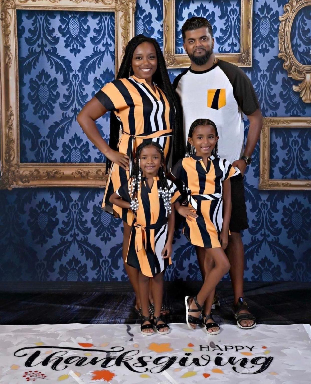 Jasmine and Richard Ramnarine with their daughters, Royce and Reign.