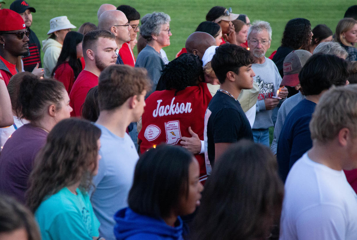 Hundreds gather at the Twin Lakes High School football field Wednesday night for a vigil honoring Kayvion Jackson, on June 8, 2022, in Monticello.