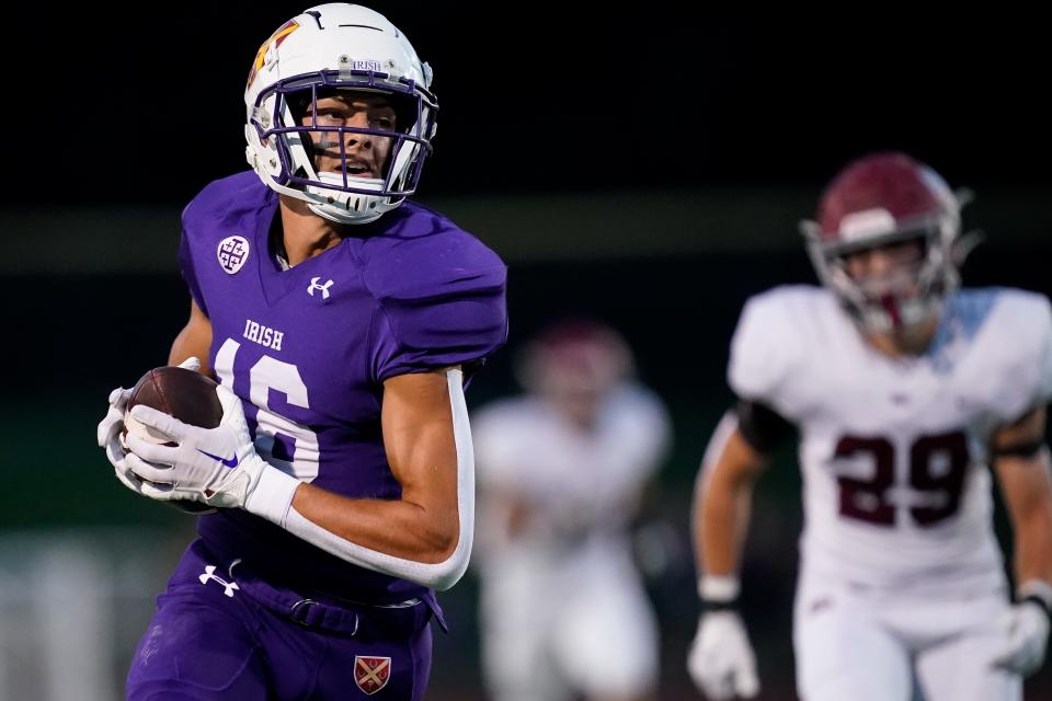 Father Ryan's Charlie Becker (16) runs in a touchdown against MBA during the first quarter at Father Ryan High School in Nashville, Tenn., Friday, Sept. 15, 2023.