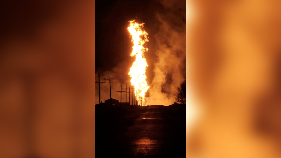 A fire burns due to a gas pipeline explosion in Laverne, Oklahoma, U.S. January 30, 2024, in this screen grab taken from a video.  / Credit: Booker Fire Department/Handout via REUTERS