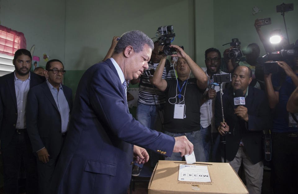 Leonel Fernandez, a former president of the Dominican Republic who is running for the presidential nomination with the political party Partido de la Liberacion Dominicana, votes during the primary election in Santo Domingo, Dominican Republic, Sunday, Oct. 6, 2019. (AP Photo/Tatiana Fernandez)