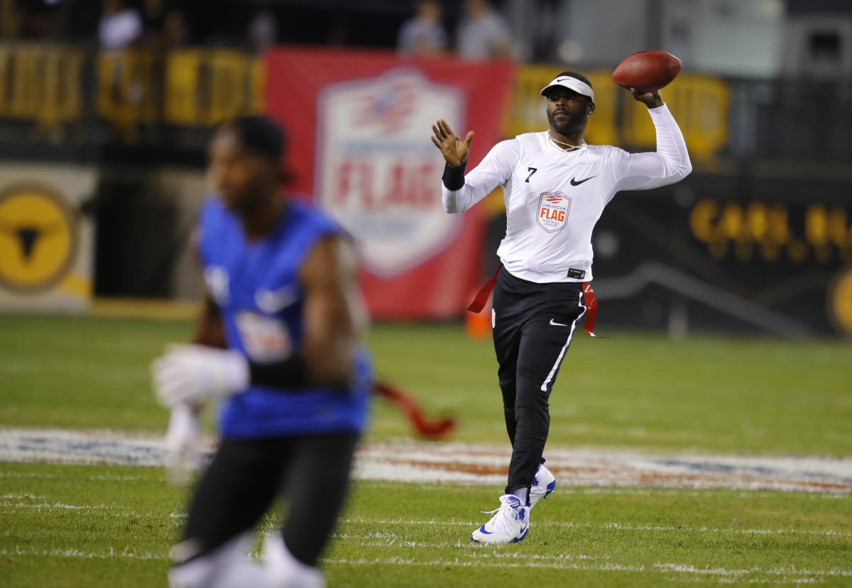 Michael Vick of the Atlanta Falcons throws a pass against the