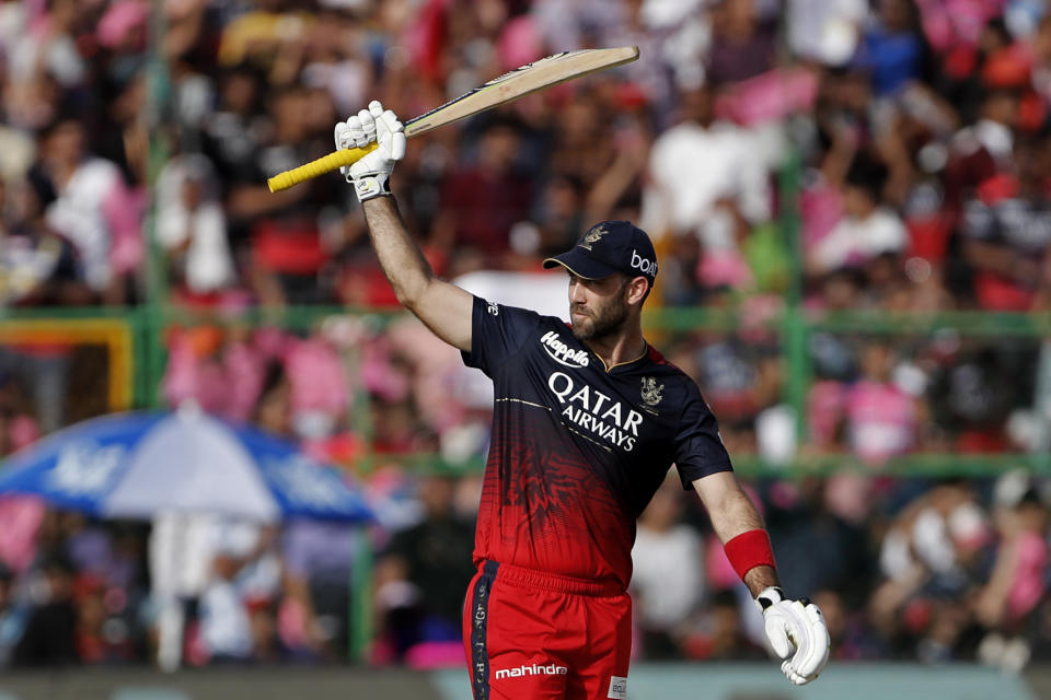 Royal Challengers Bangalore's Glenn Maxwell celebrates scoring fifty runs during the Indian Premier League cricket match between Rajasthan Royals and Royal Challengers Bangalore in Jaipur, India, Sunday, May 14, 2023. (AP Photo/Surjeet Yadav)