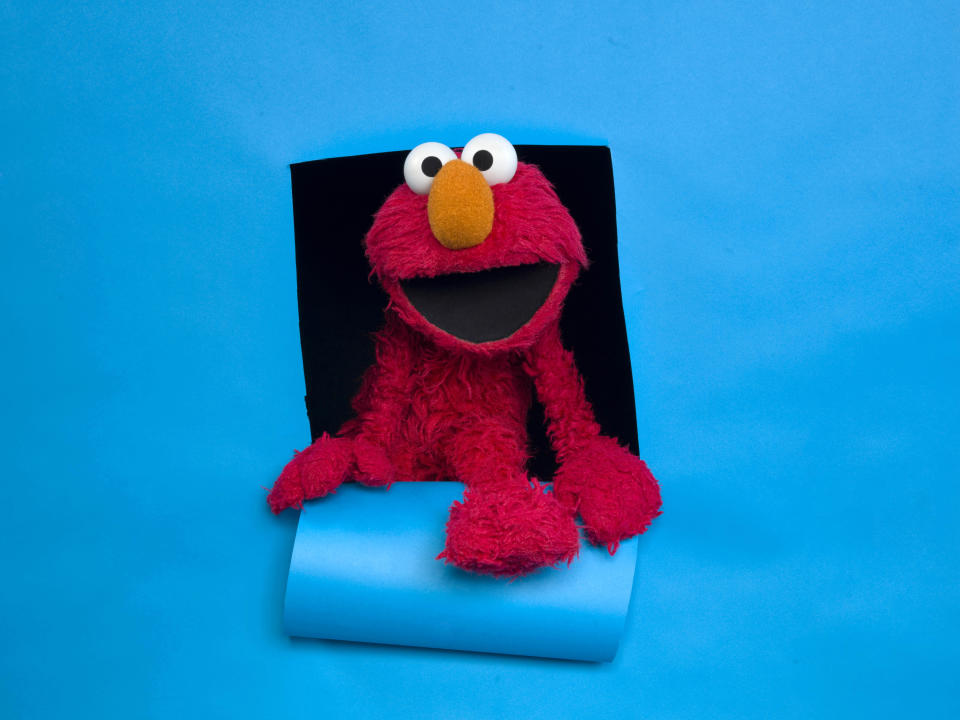 FILE - In this Jan. 24, 2011, file photo, Elmo of the film "Being Elmo" poses for a portrait in the Fender Music Lodge during the 2011 Sundance Film Festival in Park City, Utah. A viral video posted online Friday, March 17, 2017, imagined Elmo getting fired from "Sesame Street" due to PBS budget cuts. (AP Photo/Victoria Will, File)