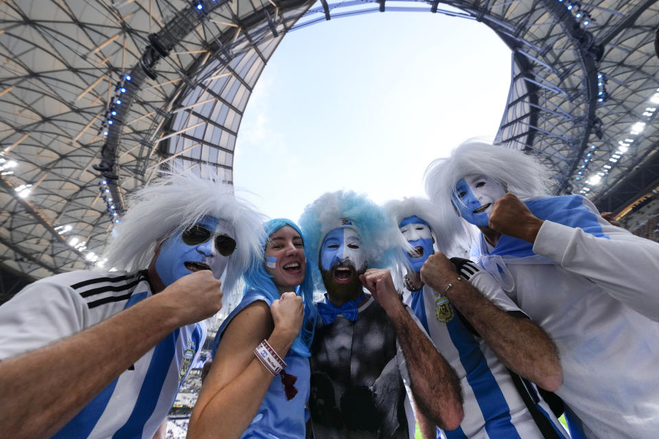 Argentinian fans cheer before the the World Cup final soccer match between Argentina and France at the Lusail Stadium in Lusail, Qatar, Sunday, Dec. 18, 2022. (AP Photo/Petr David Josek)