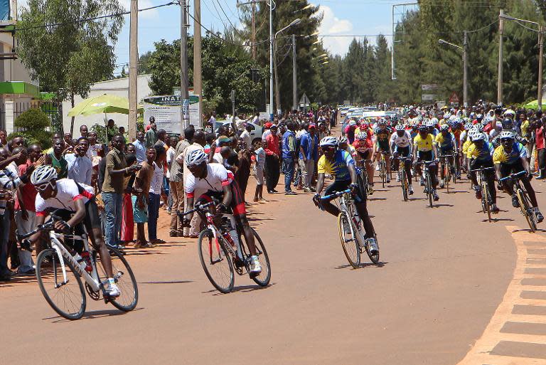 Cyclists compete in the first stage of the Tour of Rwanda in Kigali on November 17, 2014