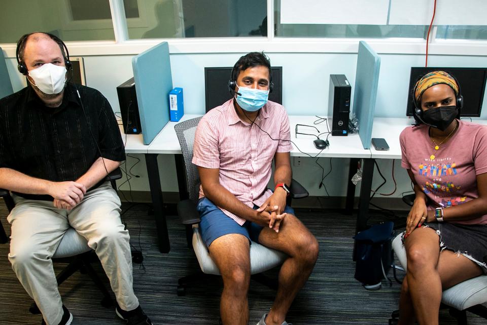 From left, Ryan Dickson, director of crisis helplines, Parth Patel, youth mobile crisis coordinator, and Amel Ali, diversity, equity and inclusion outreach specialist, pose for a photo at their 988 call center, Tuesday, July 12, 2022, at CommUnity Crisis Services and Food Bank in Iowa City, Iowa. 