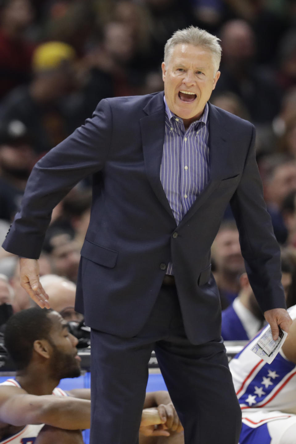 Philadelphia 76ers head coach Brett Brown gives instructions to players in the first half of an NBA basketball game against the Cleveland Cavaliers, Wednesday, Feb. 26, 2020, in Cleveland. (AP Photo/Tony Dejak)