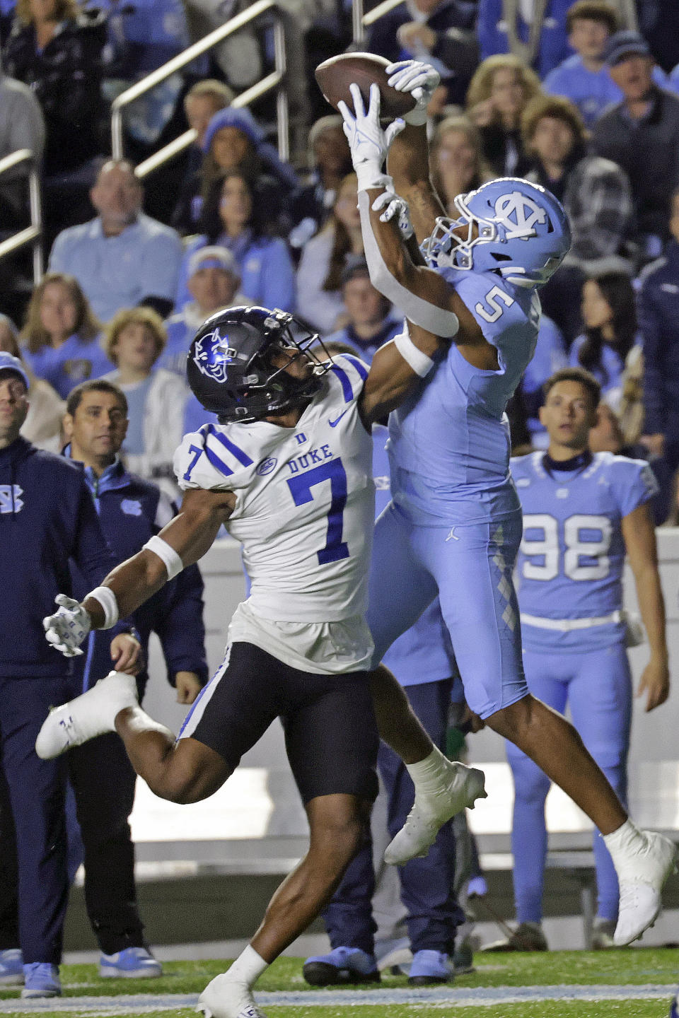 North Carolina wide receiver J.J. Jones (5) catches a pass over Duke cornerback Al Blades Jr. (7) during the first half of an NCAA college football game Saturday, Nov. 11, 2023, in Chapel Hill, N.C. (AP Photo/Chris Seward)