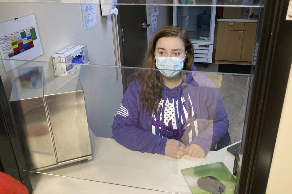 FILE—Vanessa Caudel, a nurse, sits at her work station in the Great Circle treatment center on Feb. 24, 2022, in Salem, Ore., where she provides doses of methadone, which can relieve the "dope sick" symptoms a person in opioid withdrawal experiences. Almost two years after Oregonians voted to decriminalize drugs and dedicate hundreds of millions of dollars to treatment services, the pioneering effort has been struggling to show progress. (AP Photo/Andrew Selsky, File)