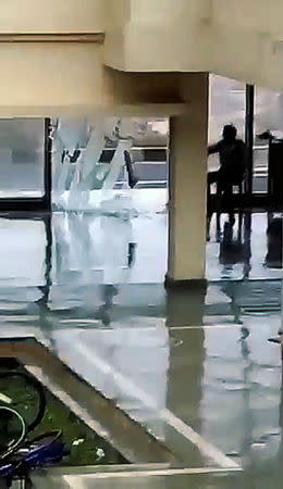 A window glass shatters during Cyclone Fani in Bhubaneswar, Odisha, India May 3, 2019 in this still image taken from a video obtained from social media. AMAN PRATAP SINGH/via REUTERS