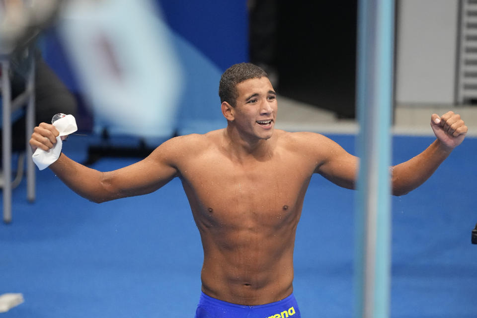 Ahmed Hafnaoui, of Tunisia, celebrates after winning the final of the men's 400-meter freestyle at the 2020 Summer Olympics, Sunday, July 25, 2021, in Tokyo, Japan. (AP Photo/Petr David Josek)