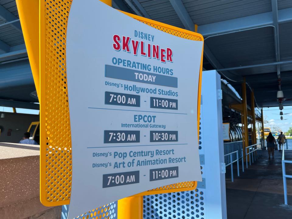 sign showing the hours of operation for the disney skyliner