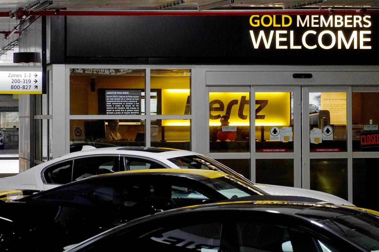 Vehicles wait for renters at a Hertz car rental location in the Miami International Airport on October 25, 2021 in Miami, Florida.