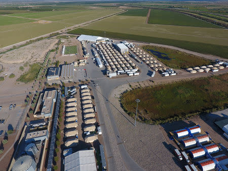 A tent city set up to hold immigrant children separated from their parents or who crossed the U.S. border on their own is seen in Tornillo, Texas, U.S., in this U.S. Department of Health and Human Services (HHS) image released on October 12, 2018. Courtesy HHS/Handout via REUTERS