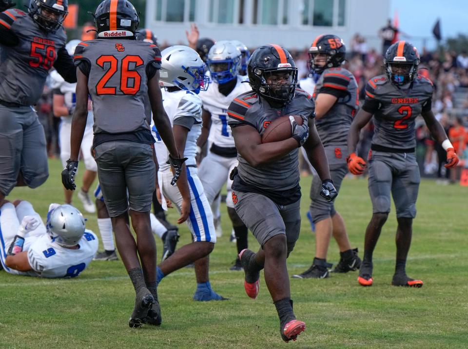 Spruce Creek's Anthony Hayden (7) trots into the end zone for a touchdown against Deltona at Spruce Creek High School in Port Orange, Friday, Sept. 1, 2023.