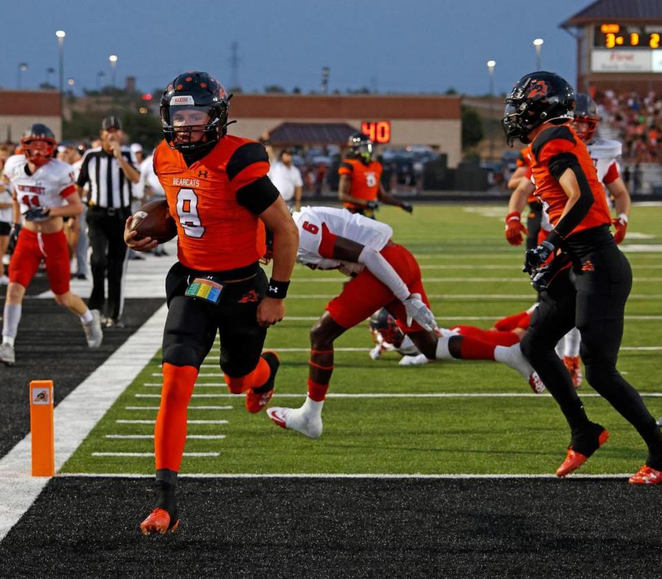 Aledo quarterback Hauss Hejny (8), the 2023 Fort Worth-area Offensive Player of the Year, rushes in for the touchdown. Special to the Star-Telegram/Bob Booth