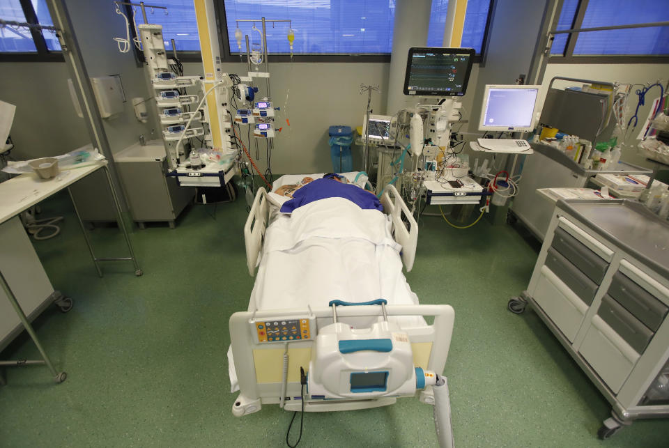 A patient in the COVID-19 Intensive Care Unit of the Papa Giovanni XIII hospital in Bergamo, Italy, Thursday, March 18, 2021. Bergamo’s state-of-the-art Pope John XXIII Hospital verged on collapse last March: as army trucks ferried virus dead from the city’s over-taxed crematoria, doctors struggled to care for 600 COVID patients, 100 in intensive care. One year later, the picture is much improved: the hospital now is treating fewer than 200 virus patients, just one quarter of those requiring intensive care. (AP Photo/Antonio Calanni)