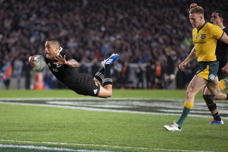 All Blacks halfback Aaron Smith dives over to score against Australia during a Bledisloe Cup rugby test between the All Blacks and Australia at Eden Park in Auckland, New Zealand, Saturday, Aug. 17, 2019. (Brett Phibbs/SNPA via AP)