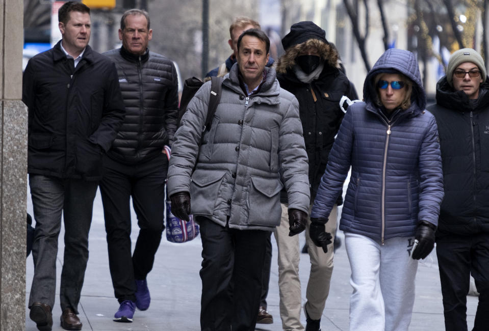 Major League Baseball deputy commissioner Dan Halem, center, arrives for a meeting in New York, Monday, Jan. 24, 2022, for the first in-person baseball negotiating session since the MLB lockout began. At far left is Patrick Houlihan, Senior Vice President & Deputy General Counsel, Labor Relations at Major League Baseball, and second from left is Colorado Rockies owner Dick Montfort. (AP Photo/Craig Ruttle)