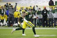 Green Bay Packers' Preston Smith runs for a touchdown on a fumble recovery during the first half of an NFL football game against the Chicago Bears Sunday, Nov. 29, 2020, in Green Bay, Wis. (AP Photo/Mike Roemer)