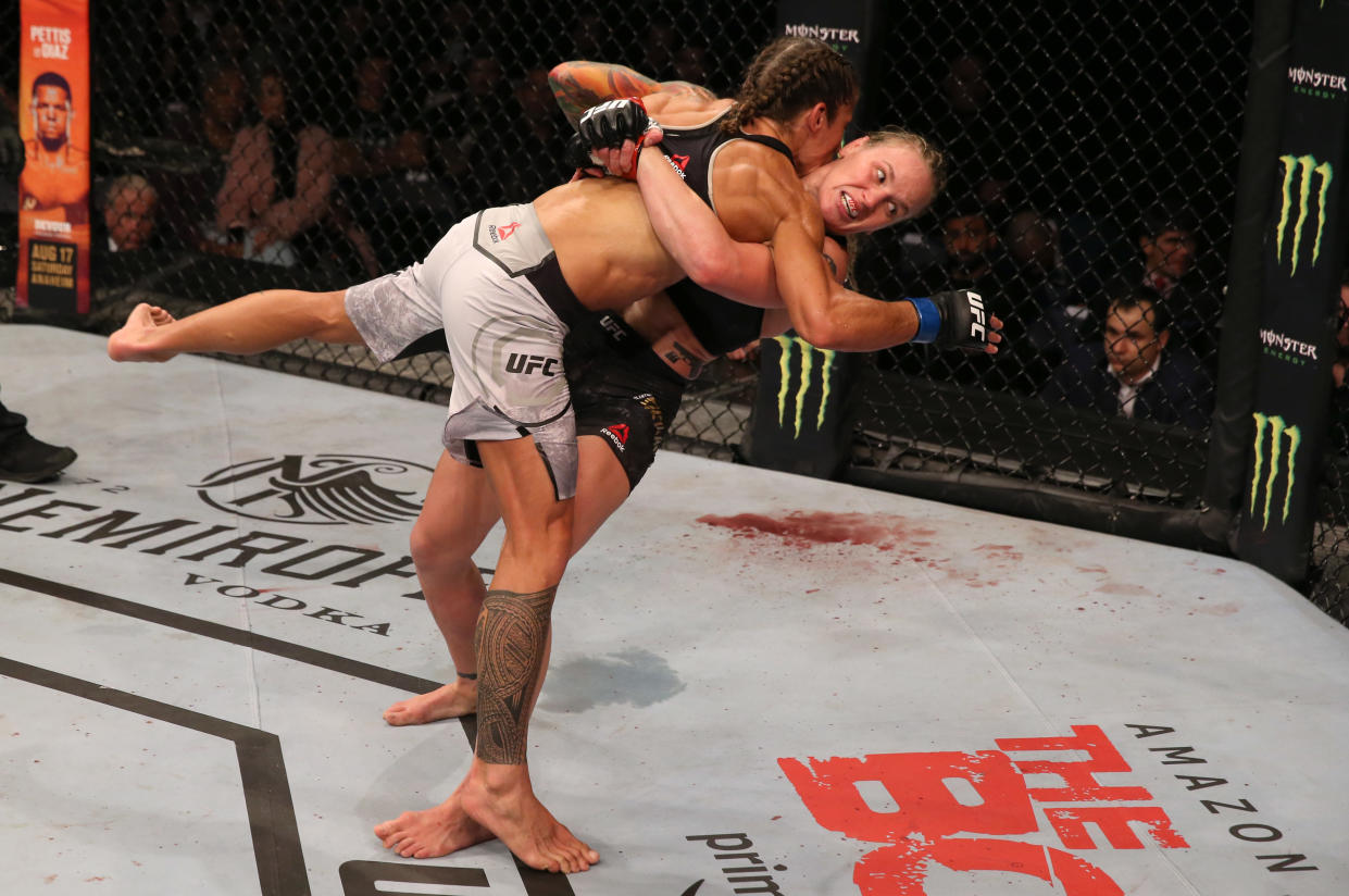 MONTEVIDEO, URUGUAY - AUGUST 10:  (R-L) Valentina Shevchenko of Kyrgyzstan takes down Liz Carmouche in their UFC women's flyweight championship fight during the UFC Fight Night event at Antel Arena on August 10, 2019 in Montevideo, Uruguay. (Photo by Alexandre Schneider /Zuffa LLC/Zuffa LLC)