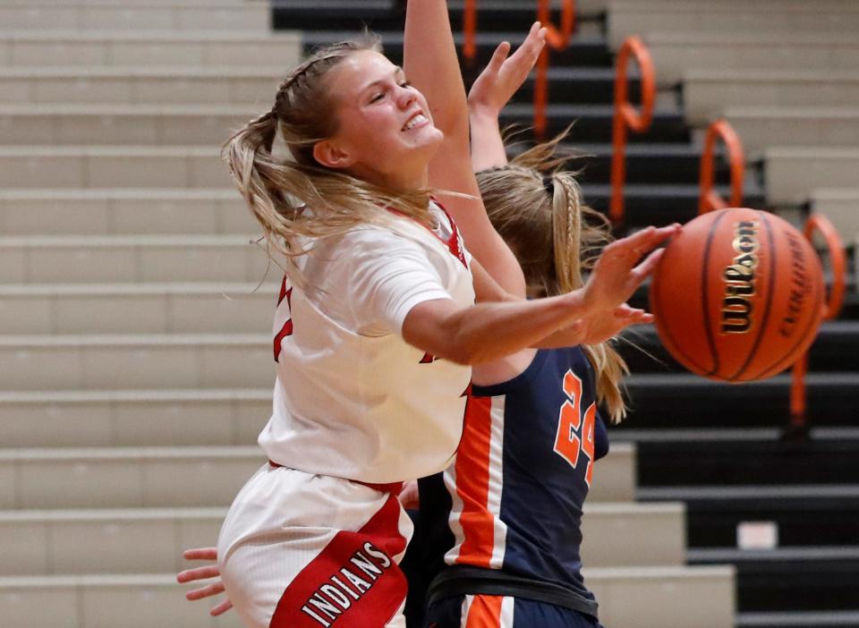 Twin Lakes guard Addie Bowsman (11) passes the ball past Harrison Raiders forward Chelsea Parker (24) during the IU Health Hoops Classic girl’s basketball fifth place game, Saturday, Nov. 18, 2023, at Harrison High School in West Lafayette, Ind. Twin Lakes won 61-42.
