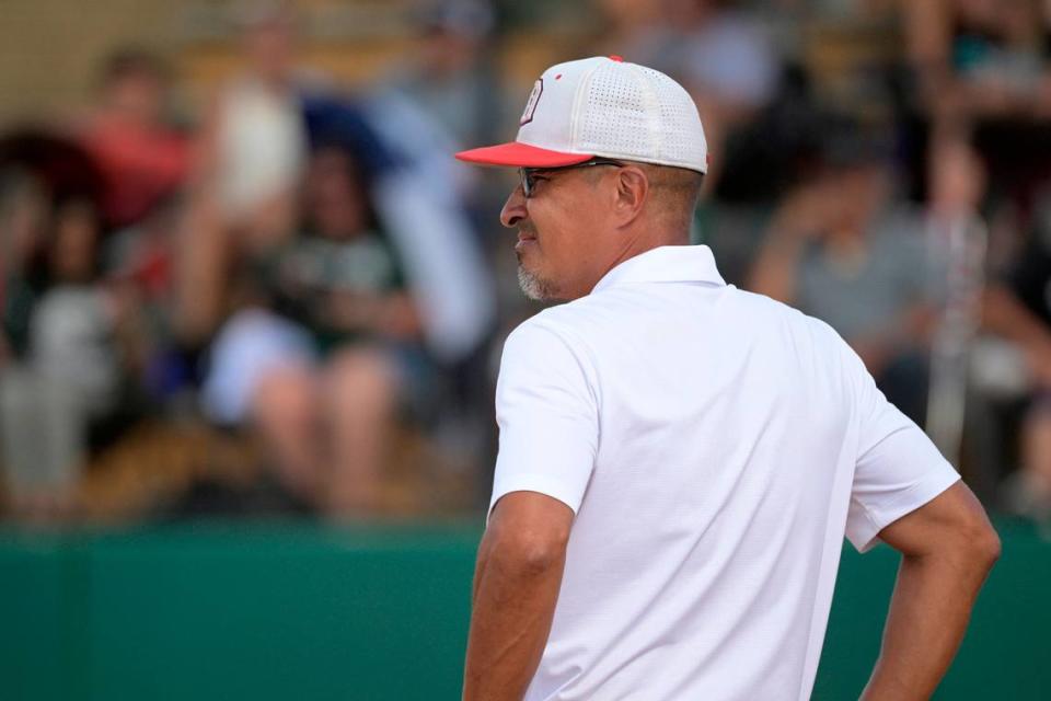 Doral Academy head coach Willie Viruet watches during the seventh inning of an FHSAA State Championship Softball Game against Melbourne, Saturday, May 28, 2022, in Clermont, Fla. (Phelan M. Ebenhack for the Miami Herald)