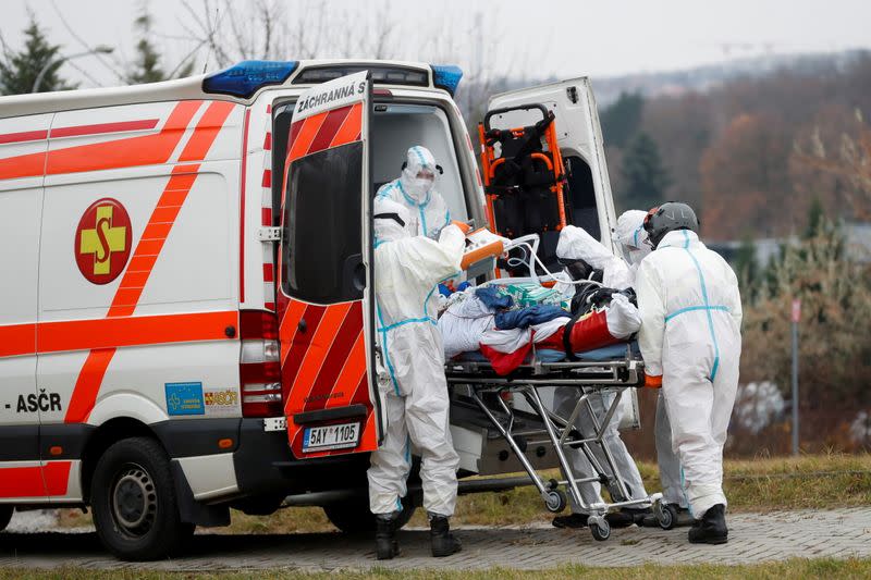 FILE PHOTO: Medical workers transport COVID-19 patients from Brno to Prague