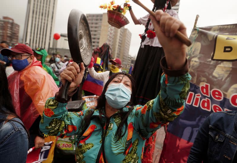 Demonstrators gather outside a local hotel where representatives of the Inter-American Commission on Human Rights (CIDH) and union leaders meet, in Bogota